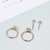 Round earrings in gold and silver