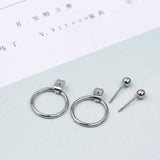 Round earrings in gold and silver