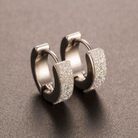 Round earrings in gold and silver