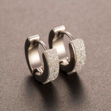 Round earrings in gold and silver