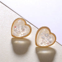 Round earrings in gold and silver