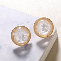 Round earrings in gold and silver