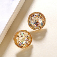 Round earrings in gold and silver