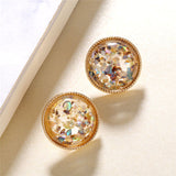 Round earrings in gold and silver
