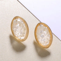 Round earrings in gold and silver