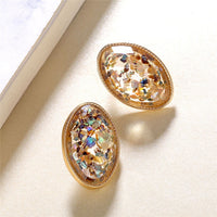Round earrings in gold and silver