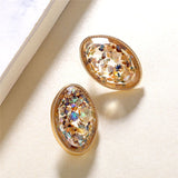 Round earrings in gold and silver