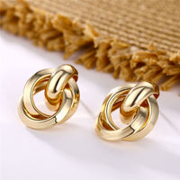 Round earrings in gold and silver