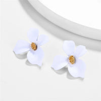 Round earrings in gold and silver