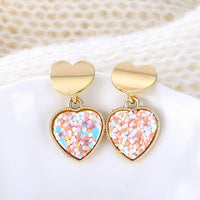 Round earrings in gold and silver