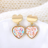 Round earrings in gold and silver