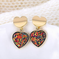 Round earrings in gold and silver