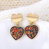 Round earrings in gold and silver