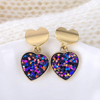 Round earrings in gold and silver
