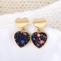 Round earrings in gold and silver