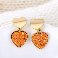 Round earrings in gold and silver