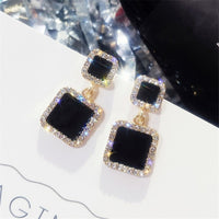 Round earrings in gold and silver