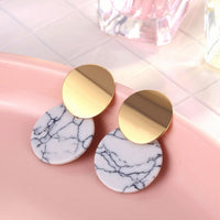 Round earrings in gold and silver