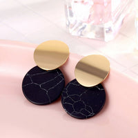 Round earrings in gold and silver