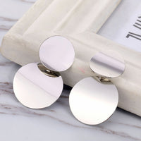 Round earrings in gold and silver