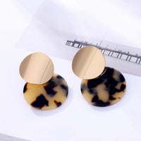 Round earrings in gold and silver