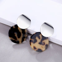 Round earrings in gold and silver