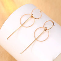 Round earrings in gold and silver