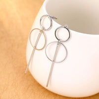 Round earrings in gold and silver