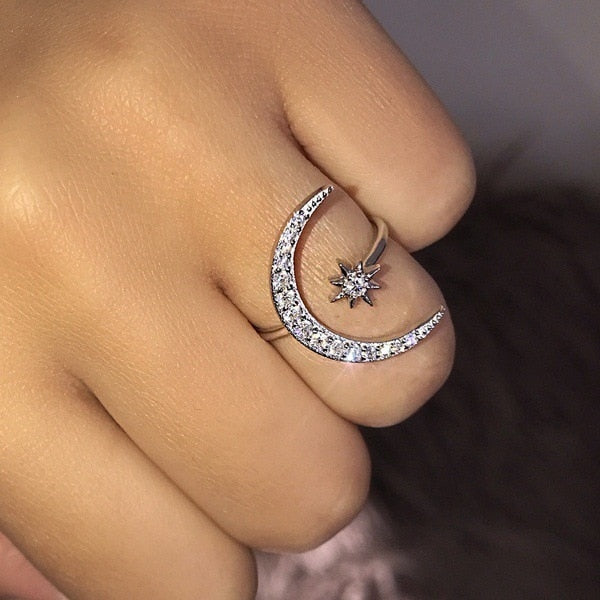 Moon-shaped ring studded with zircon crystals