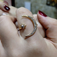 Moon-shaped ring studded with zircon crystals